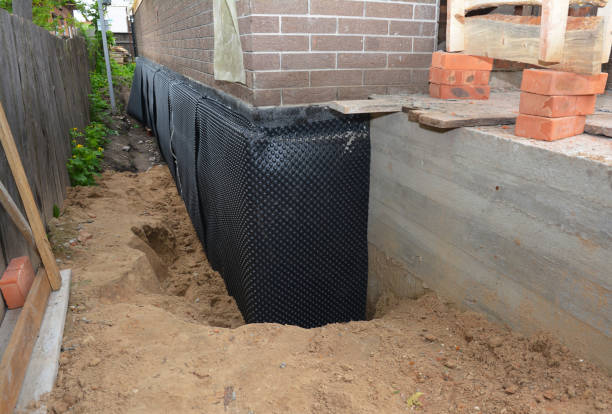 Happy homeowners after waterproofing job in Merion Station